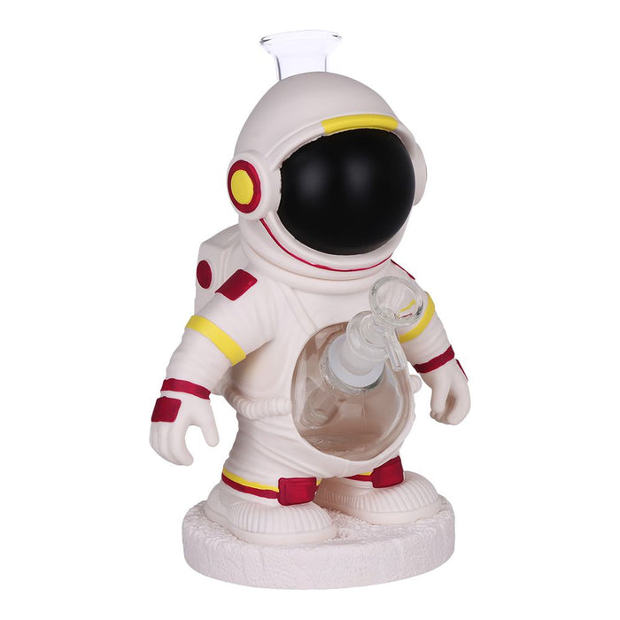 An astronaut-shaped glass bottle with a clear glass neck and a white base, decorated in a space theme with red, yellow, and black details.