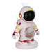 An astronaut-shaped glass bottle with a clear glass neck and a white base, decorated in a space theme with red, yellow, and black details.