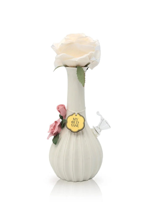 Decorative vase with a white rose and pink flowers on a white background