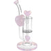 Glass smoking device with heart-shaped components on a white background