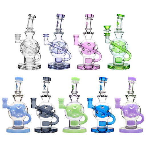 Set of colorful glass water bottles on a white background
