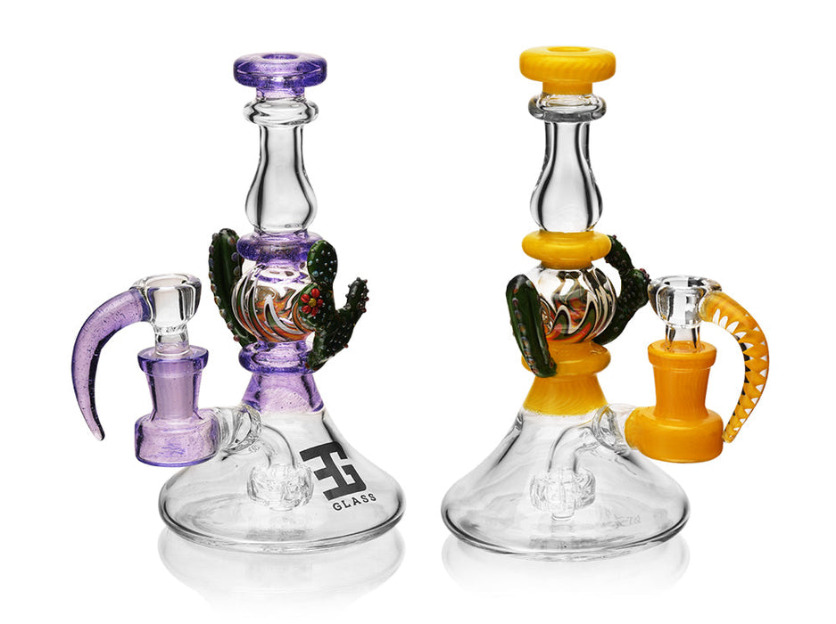 Two glass smoking accessories with colorful handles on a white background