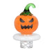 Pumpkin-shaped night light with a white base on a white background