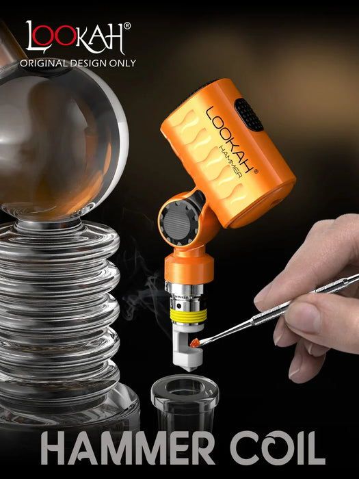 Lookah Hammer Coil device with a hand using a tool on a dark background
