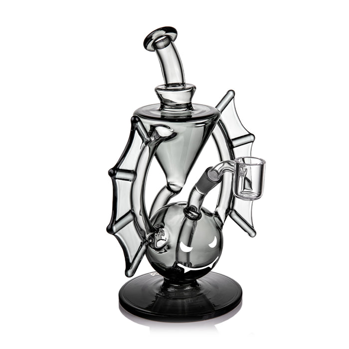 Glass smoking device with spider web design on a white background