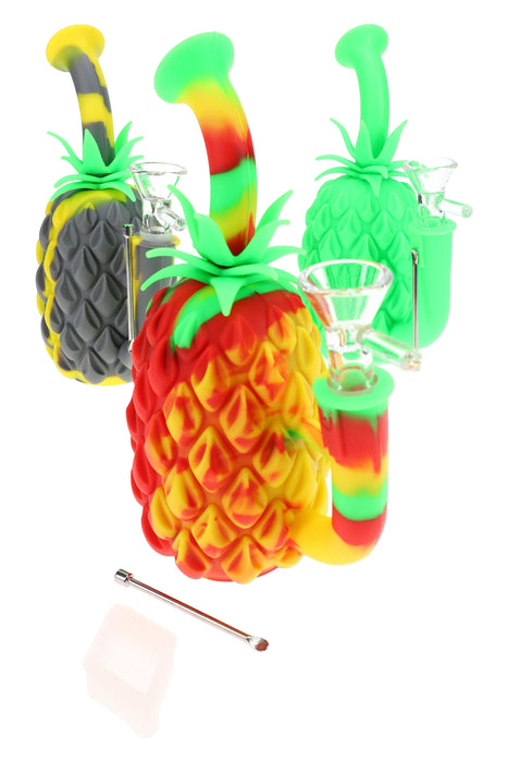 Colorful pineapple-shaped drink stirrers with a straw on a white background