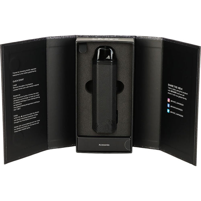 Black vape device in an open black box on a white background