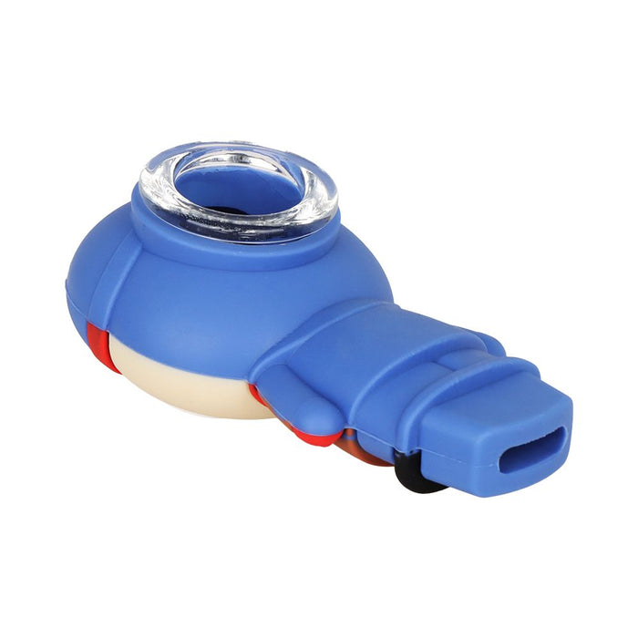 A blue silicone personal massager with a clear acrylic ring at the top, a beige inner section, and small red and black accent details, shown on a plain white background.