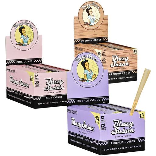 Blazy Susan cone boxes in pink, purple, and black packaging with a stick on a white background.