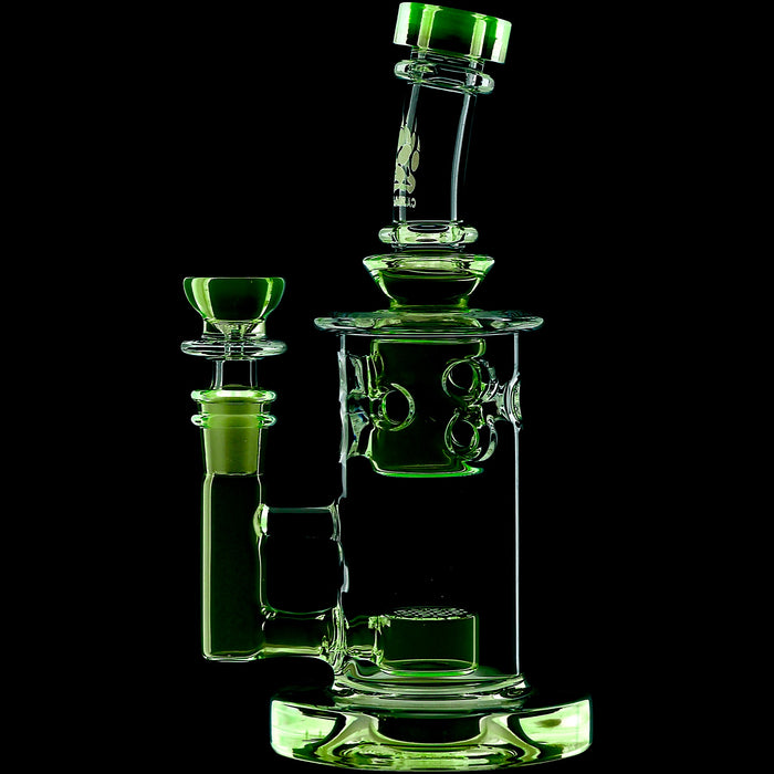 Green glass water pipe on a black background