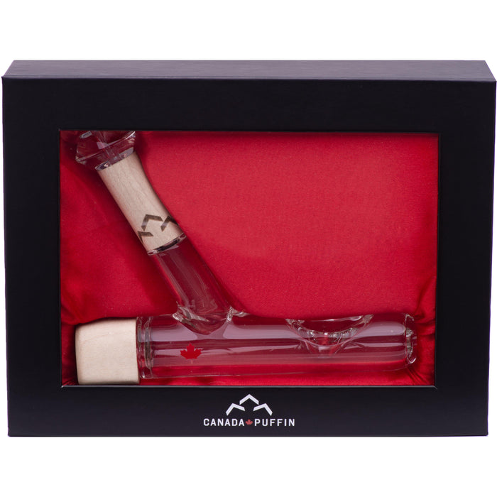 Two glass bottles with wooden caps in a black box with red interior, featuring 'Canada Puffin' branding.