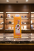 The Peoples 'Chh Ee Chh' glass water pipe in its original orange and yellow packaging box, featuring cartoon letter graphics and a product illustration on the front.