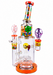 A collage showing a clear glass water pipe/bong with colorful cartoon-style inserts and accessories, alongside its orange retail box and additional color variants on a white background.