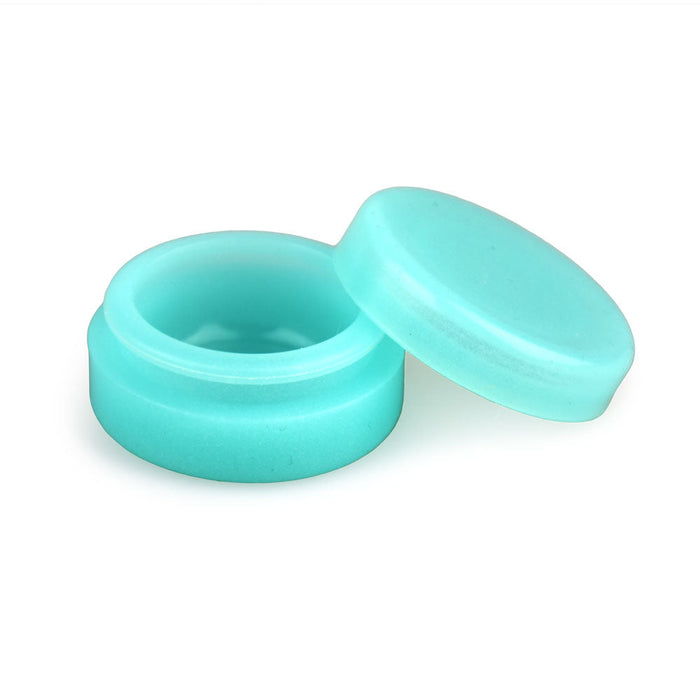 Turquoise plastic cap and container on a white background