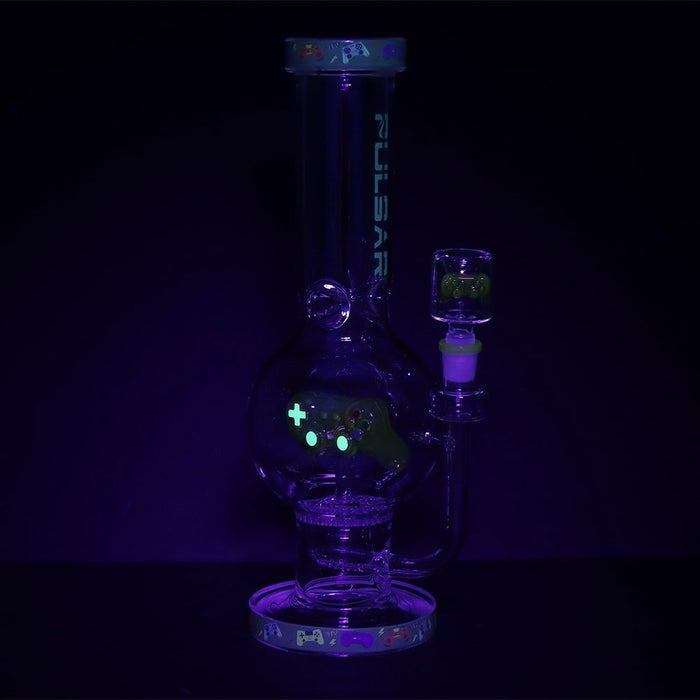Glass smoking device with glowing elements on a black background