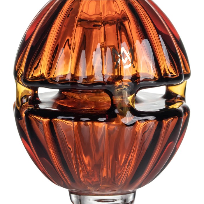 Close-up of a brown glass light bulb on a white background