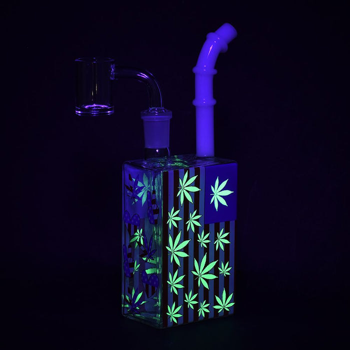 Glass water pipe with glowing green cannabis leaf patterns on a black background