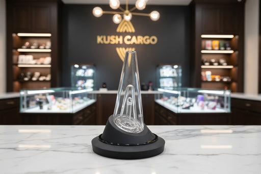 Clear glass cone on a black base against a white background