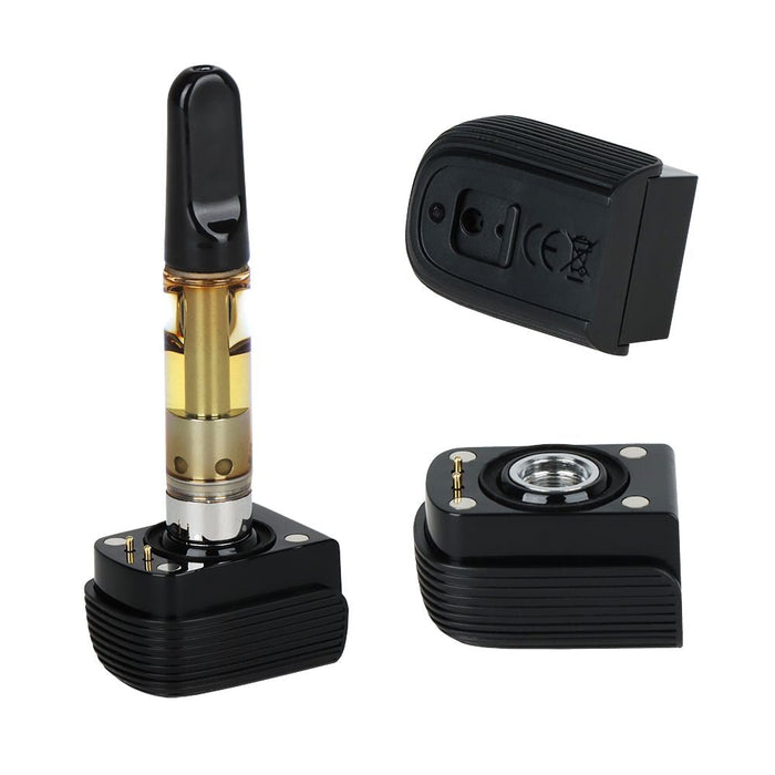 Black and gold vape cartridge with accessories on a white background