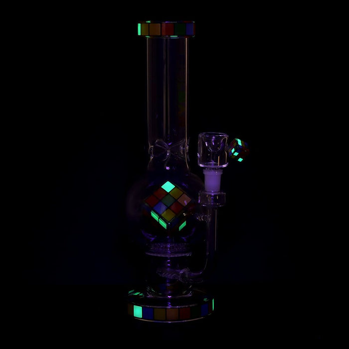 Glass smoking device with colorful geometric patterns on a black background