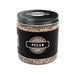 Jar of pecan wood chips with a black lid and label on a white background