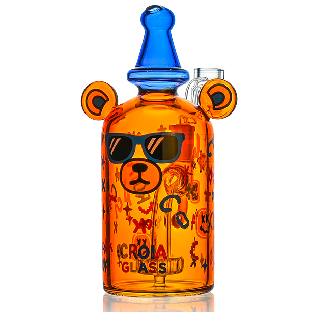 Glass smoking accessory with bear design and sunglasses on a white background