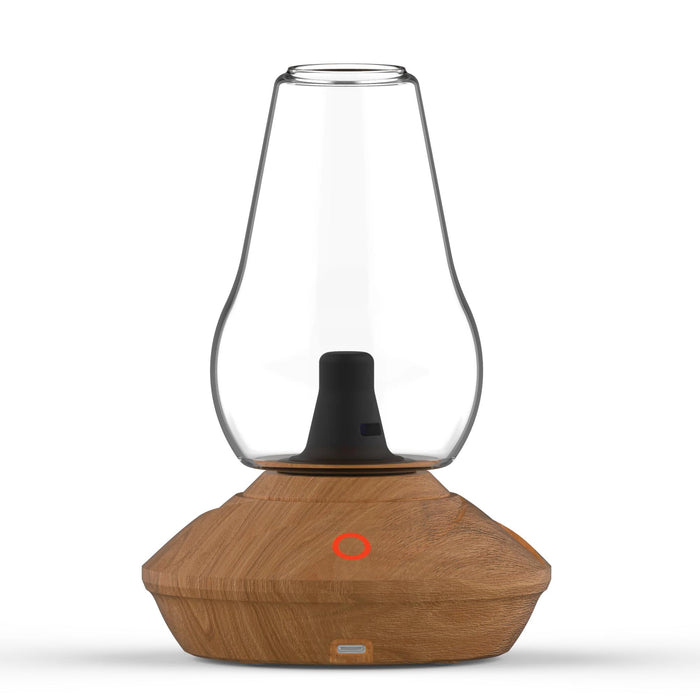 The image shows the Zenco Uno Vaporizer with a wood finish base and a clear glass tank sitting on top. There is a red power indicator on the base.